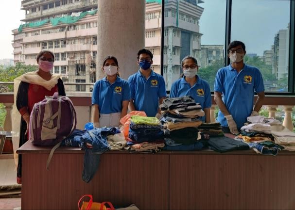 Photographs with few faculties who donated in the 3 day long clothes donation drive